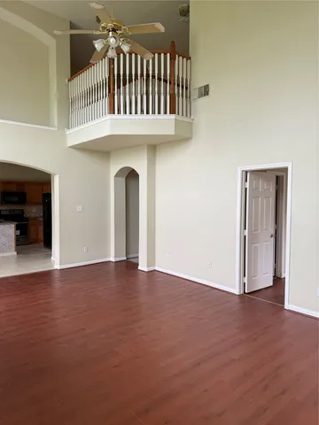 a view of an entryway door with a staircase