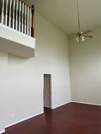 an empty room with wooden floor