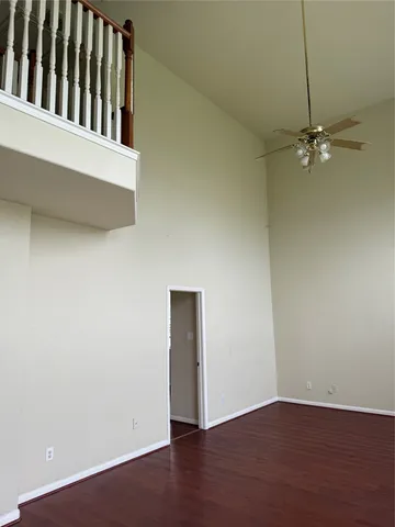 an empty room with wooden floor