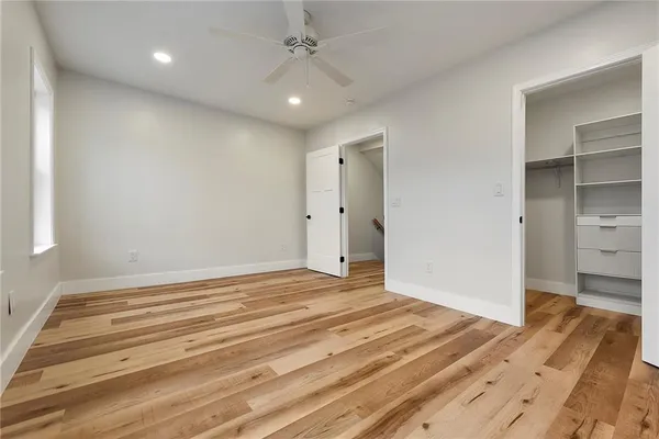 a view of a livingroom with wooden floor and closet