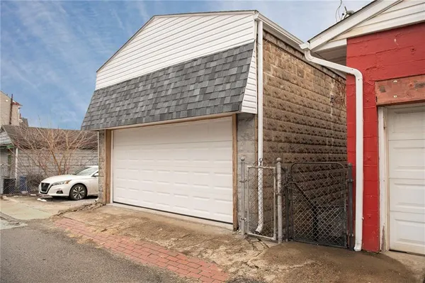 a front view of a house with parking space