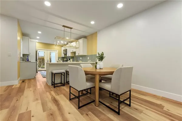 a dining room with furniture and window