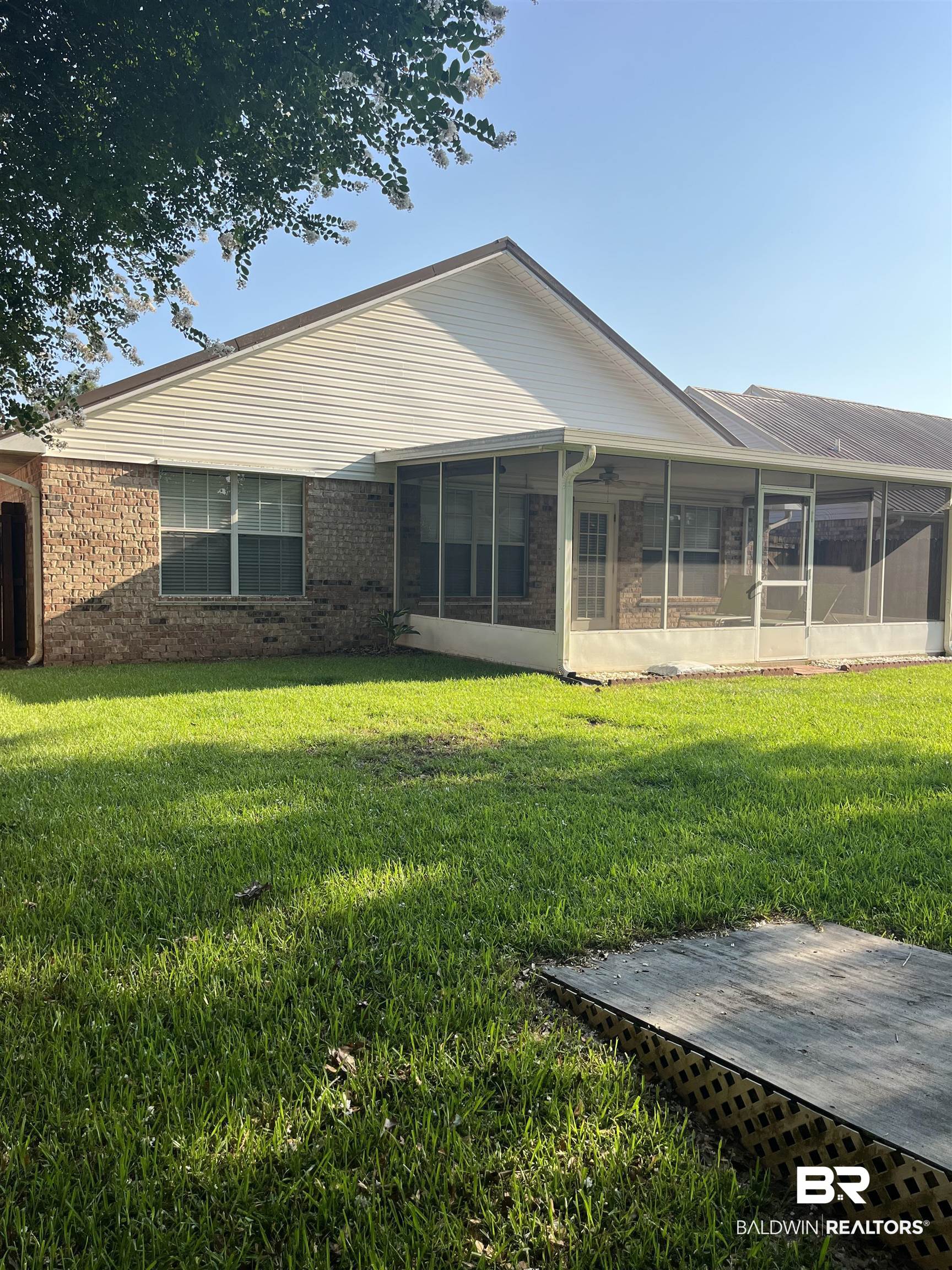 309 Cluster Street Foley, AL 36535 - Photo 32 of 38 Expansive backyard with a screened patio