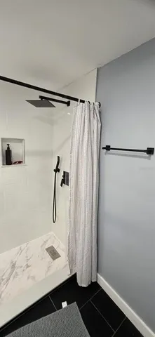 a view of a room with a hardwood floor