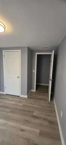 a bathroom with a sink toilet and a mirror