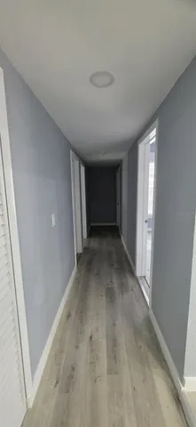 a view of a livingroom with furniture and a window