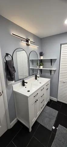 a bathroom with a shower and a sink