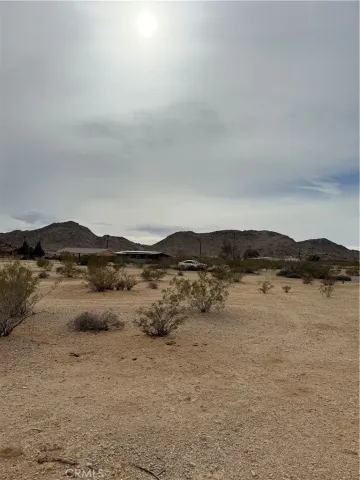 a view of ocean with mountains