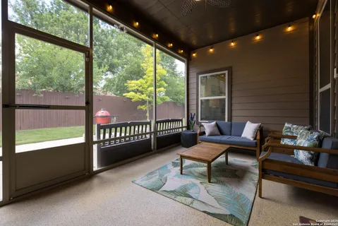 a outdoor living space with furniture and a garden