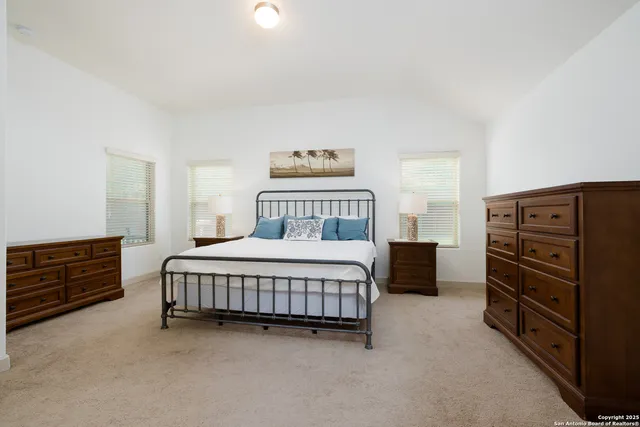 a bedroom with a bed and furniture