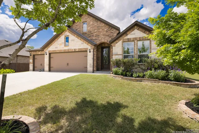 a view of a house with a backyard