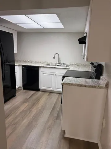 a view of a livingroom with wooden floor