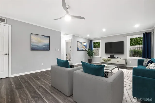 a living room with furniture and wooden floor