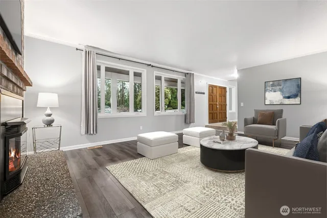 a living room with furniture and a large window