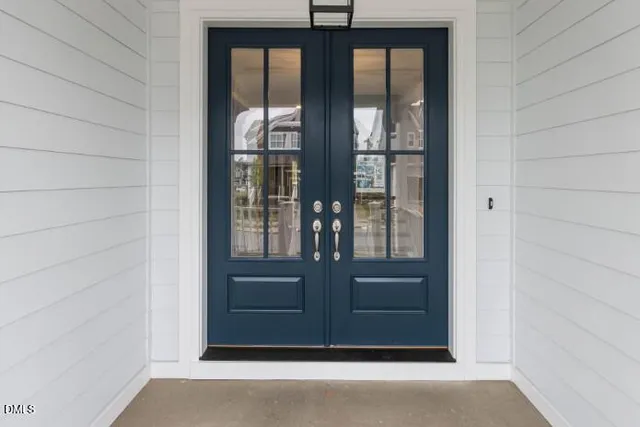 a open kitchen with cabinets a window and appliances