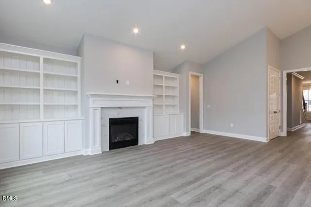 a kitchen with granite countertop a sink stove and refrigerator