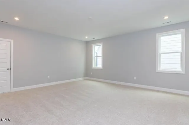 a view of a house with a backyard and a large window