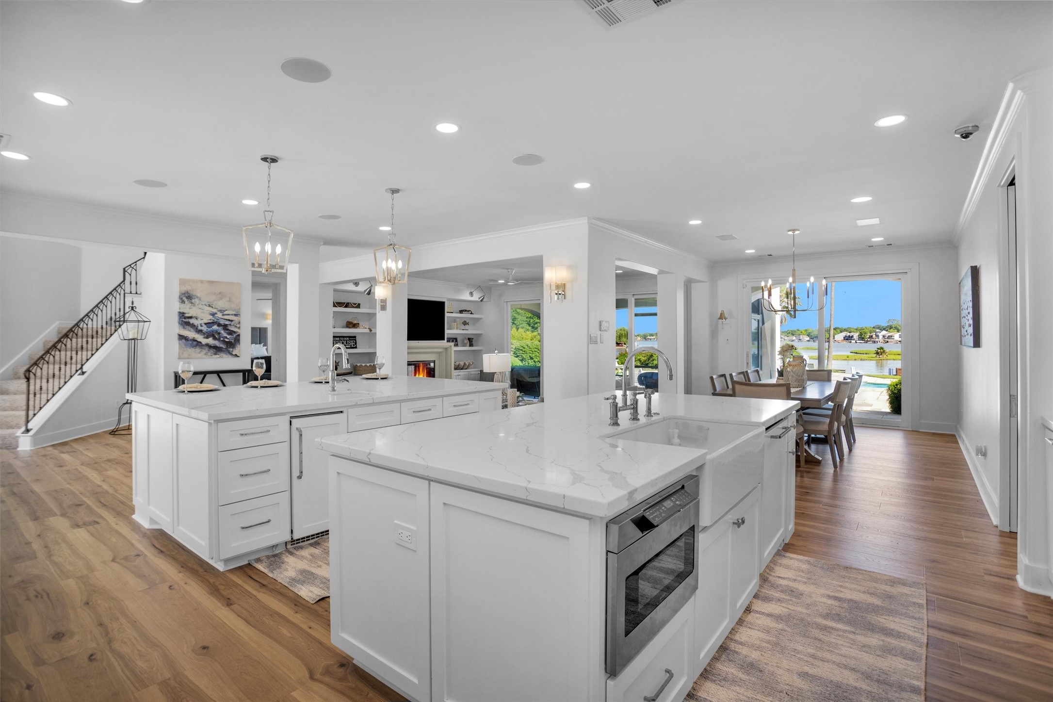 16059 Walden Road Conroe, TX 77356 - Photo 14 of 50 a large white kitchen with a large counter top appliances and cabinets