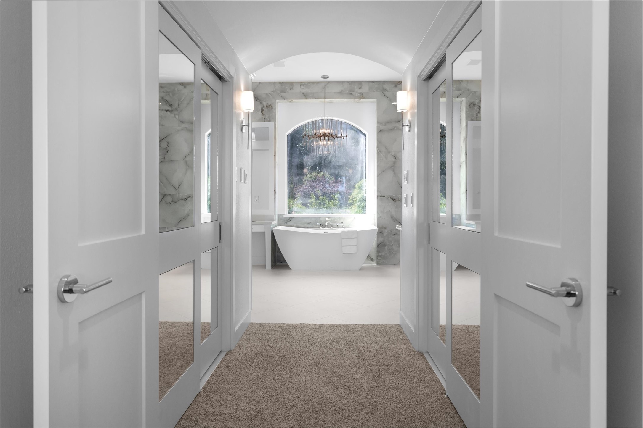 16059 Walden Road Conroe, TX 77356 - Photo 22 of 50 a living room with a fireplace and a chandelier