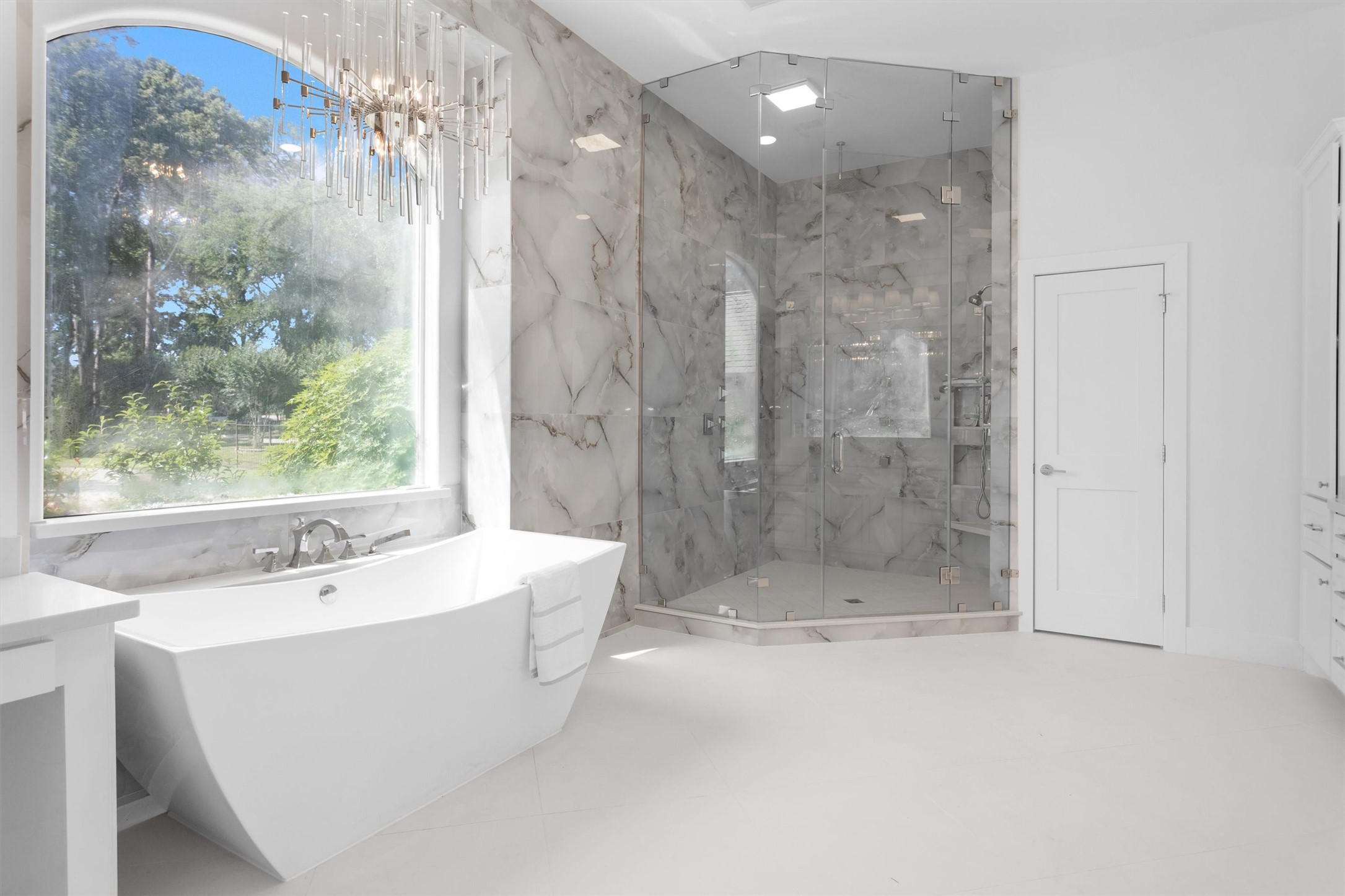 16059 Walden Road Conroe, TX 77356 - Photo 23 of 50 a bathroom with a bathtub and shower