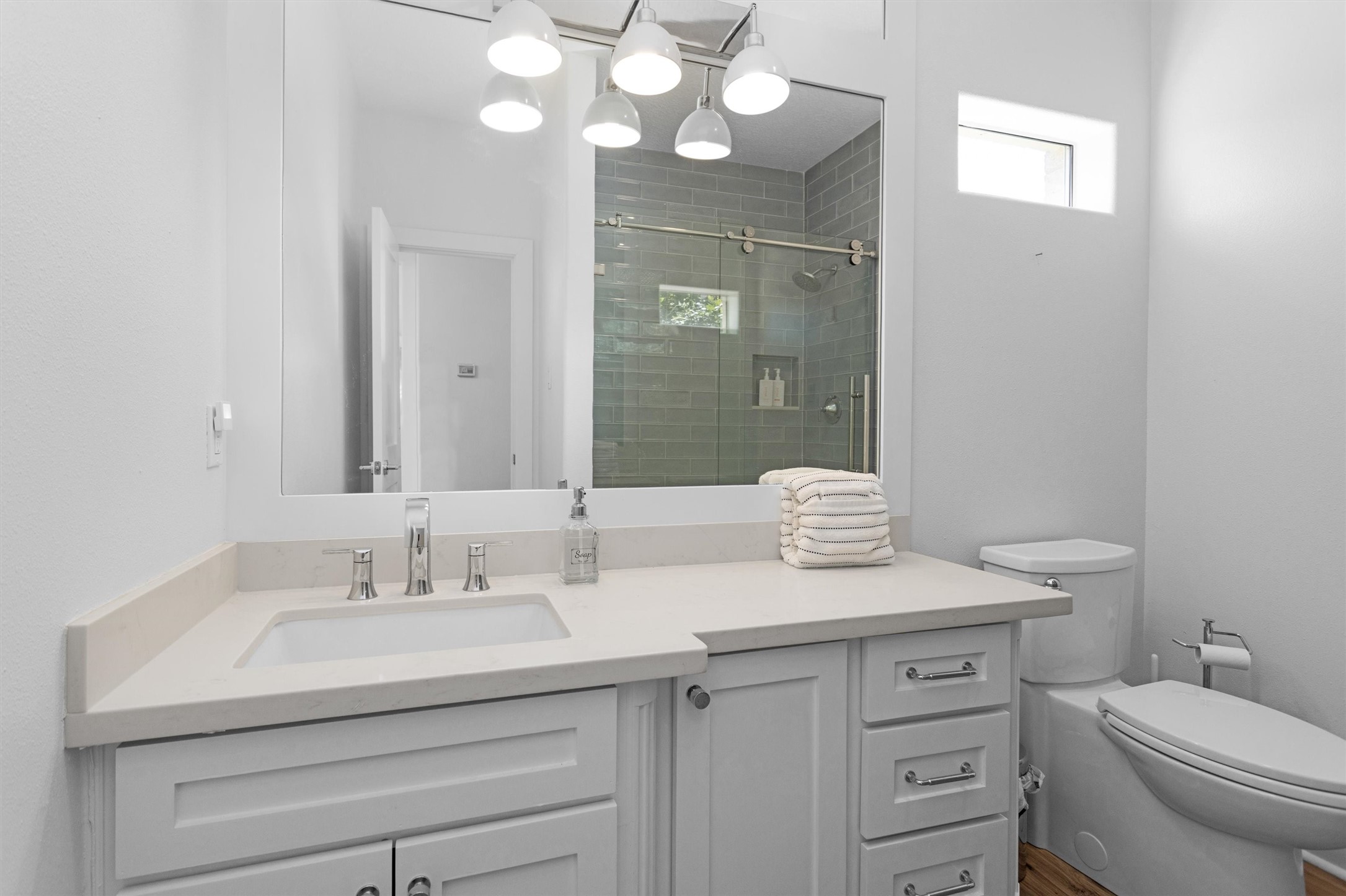 16059 Walden Road Conroe, TX 77356 - Photo 26 of 50 a bathroom with a sink a toilet and a mirror