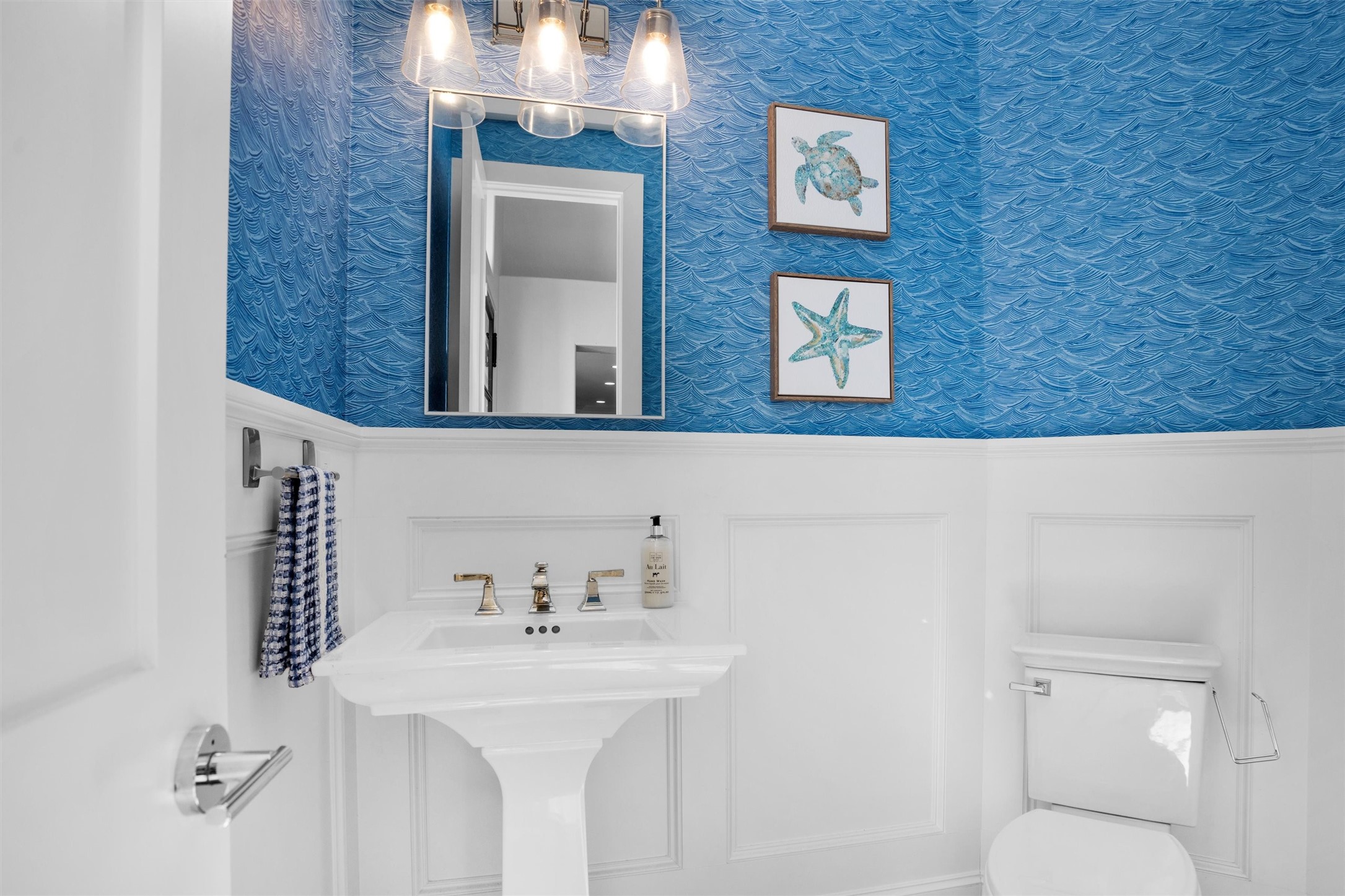 16059 Walden Road Conroe, TX 77356 - Photo 28 of 50 a bathroom with a toilet sink and mirror