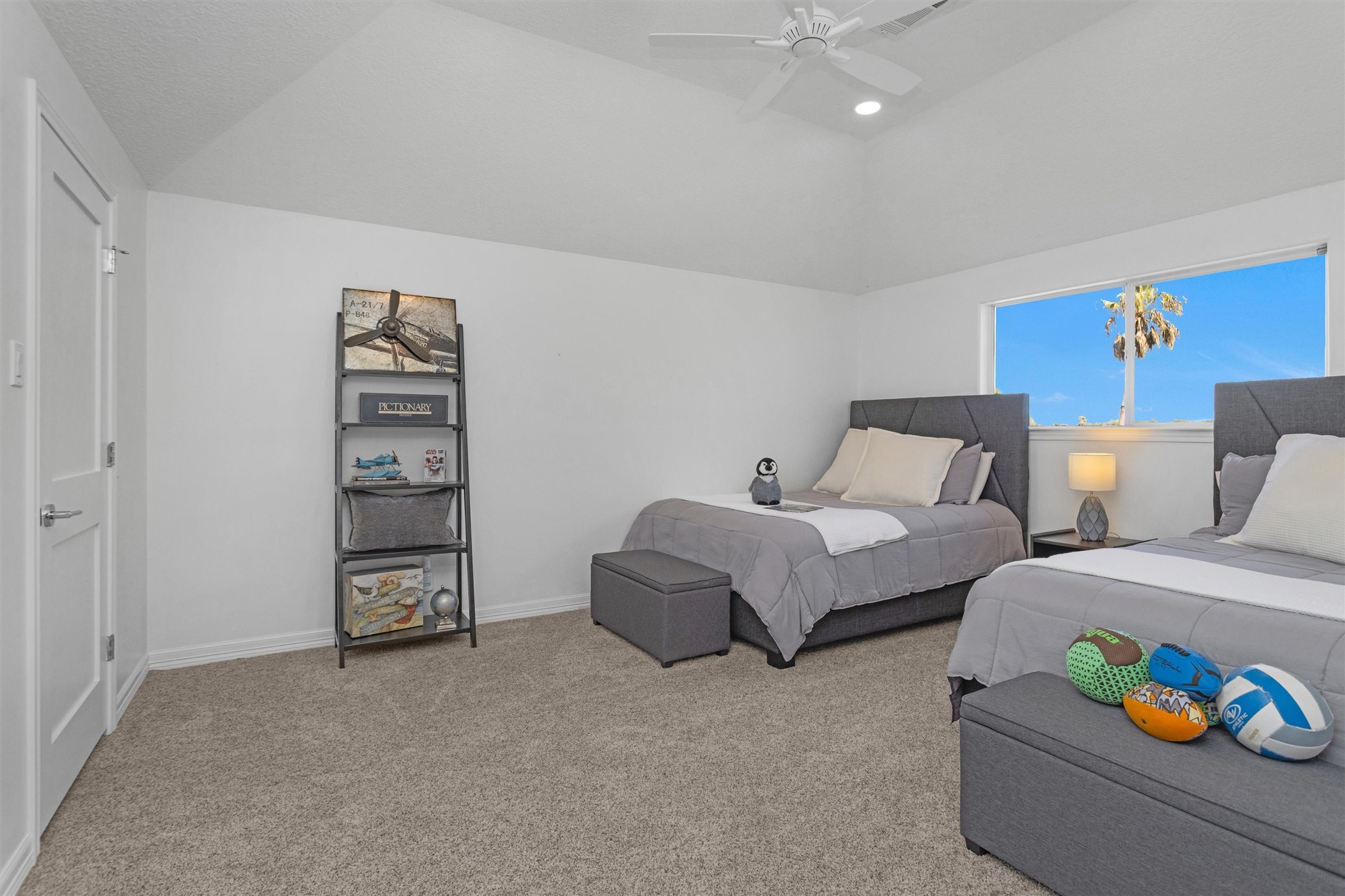 16059 Walden Road Conroe, TX 77356 - Photo 33 of 50 a spacious bedroom with two beds and a couch