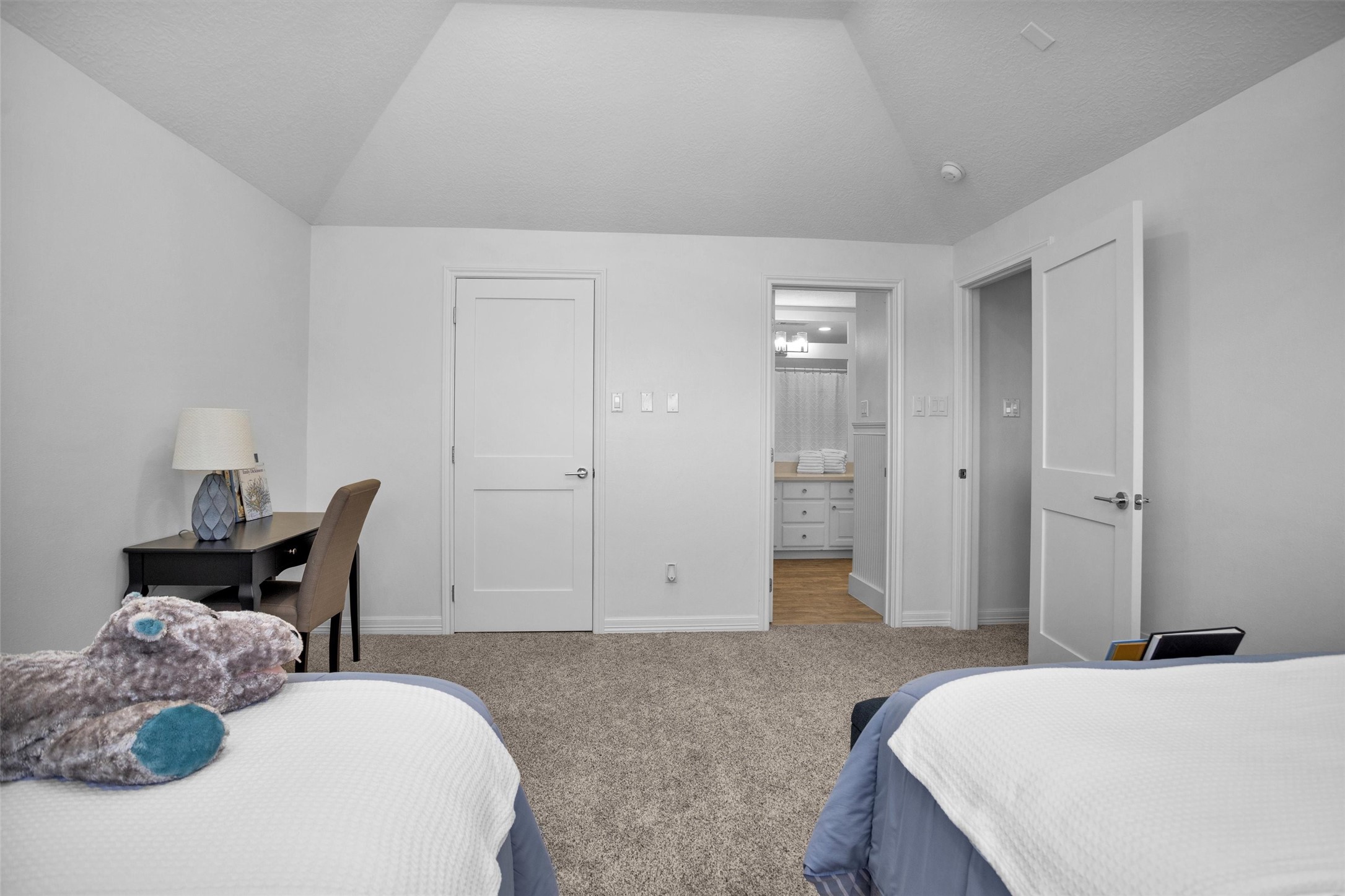 16059 Walden Road Conroe, TX 77356 - Photo 36 of 50 a bedroom with a bed and a chair