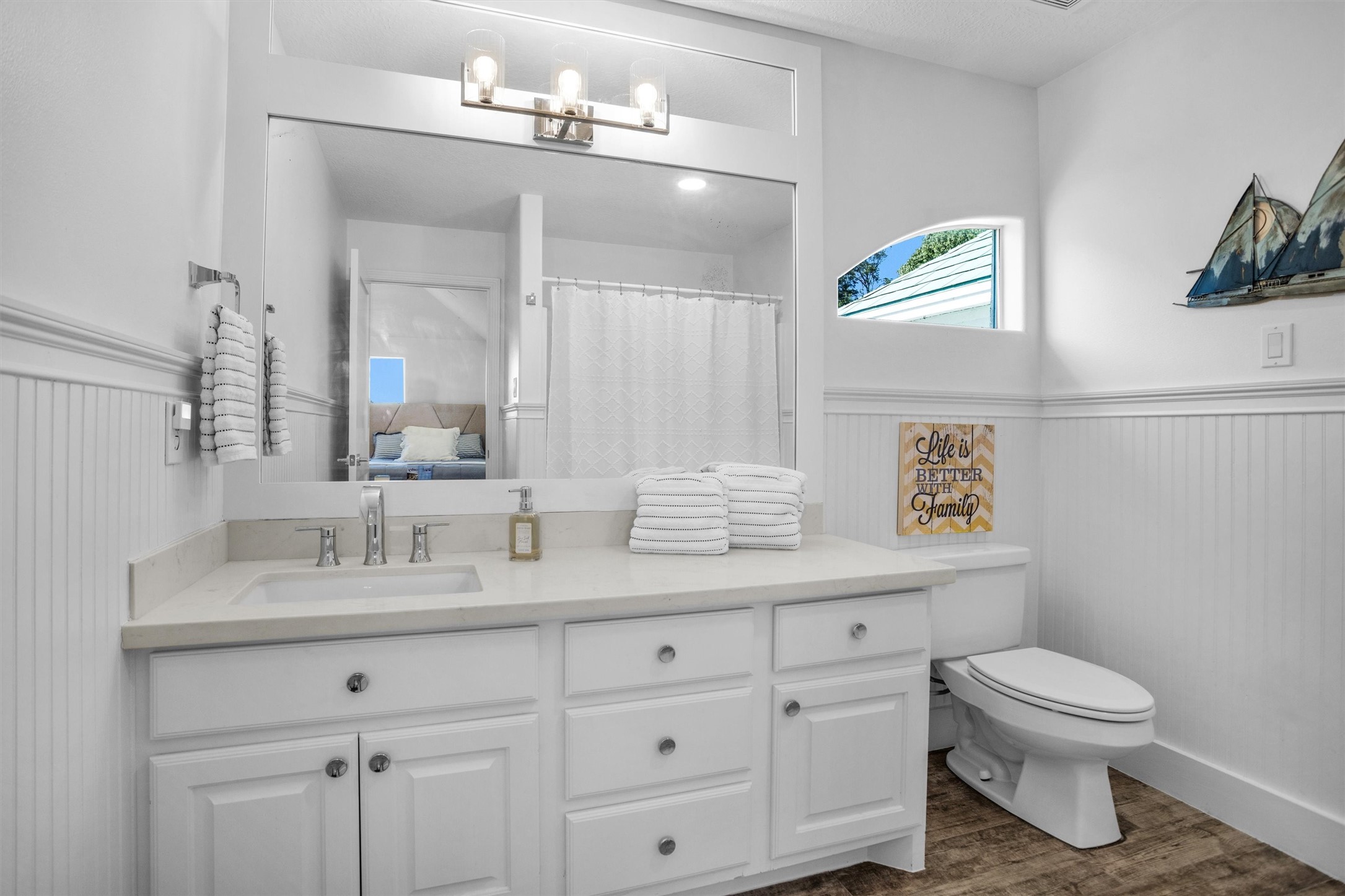 16059 Walden Road Conroe, TX 77356 - Photo 37 of 50 a bathroom with a granite countertop toilet sink and mirror