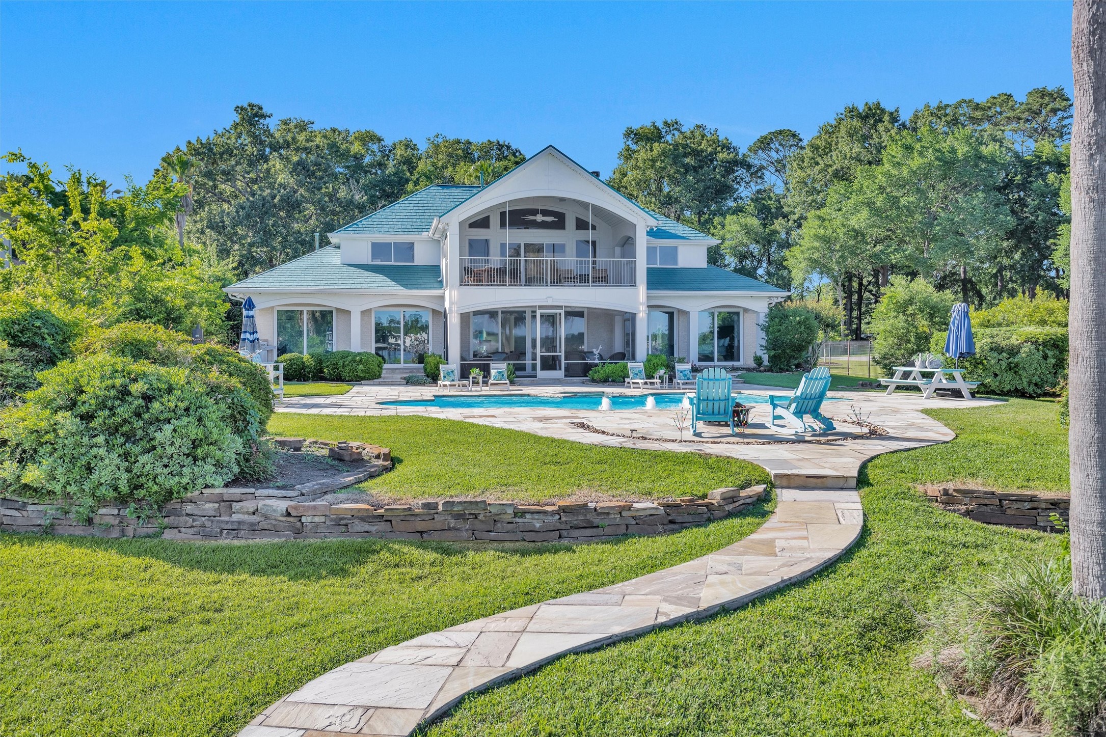 16059 Walden Road Conroe, TX 77356 - Photo 44 of 50 a view of house with swimming pool and yard