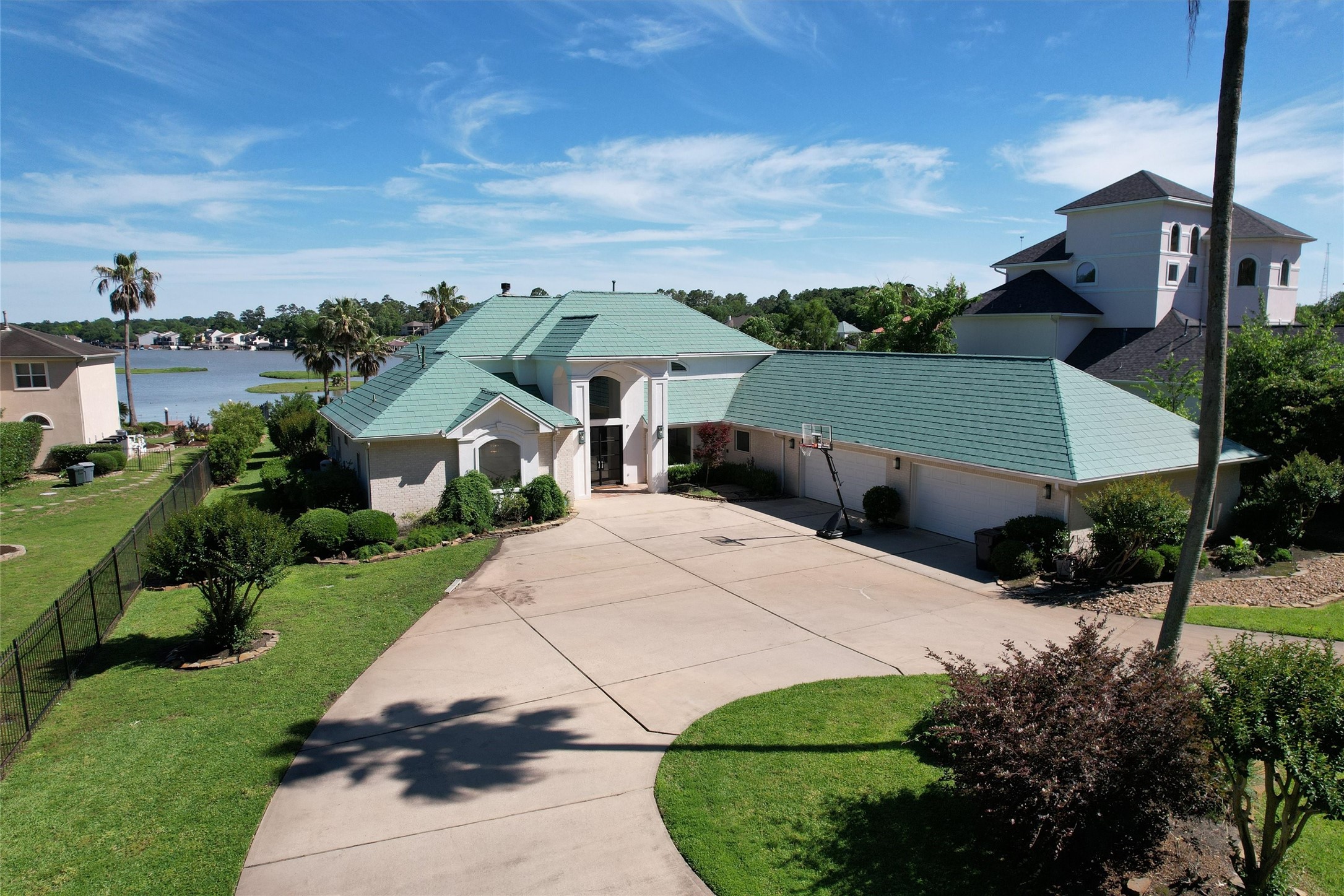 16059 Walden Road Conroe, TX 77356 - Photo 48 of 50 a view of a white house with a yard