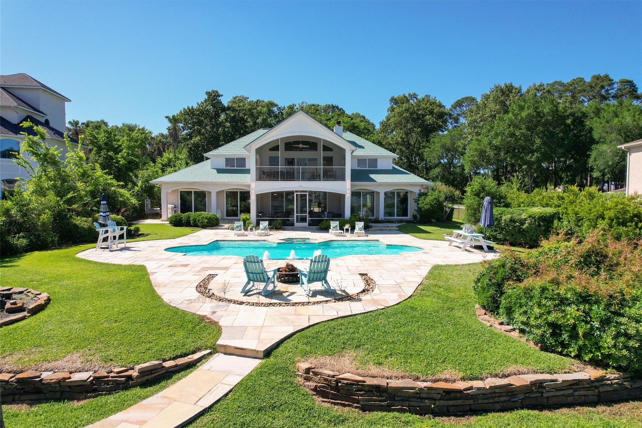 16059 Walden Road Conroe, TX 77356 - Photo 50 of 50 a view of a house with swimming pool and yard