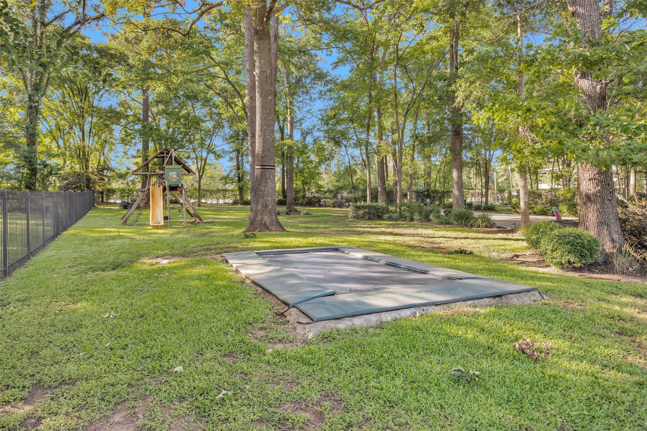 16059 Walden Road Conroe, TX 77356 - Photo 5 of 50 a view of yard with swimming pool and trees