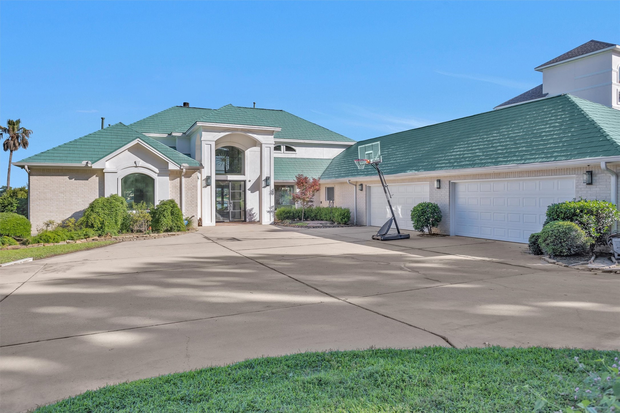 16059 Walden Road Conroe, TX 77356 - Photo 6 of 50 a front view of a house with a yard and garage