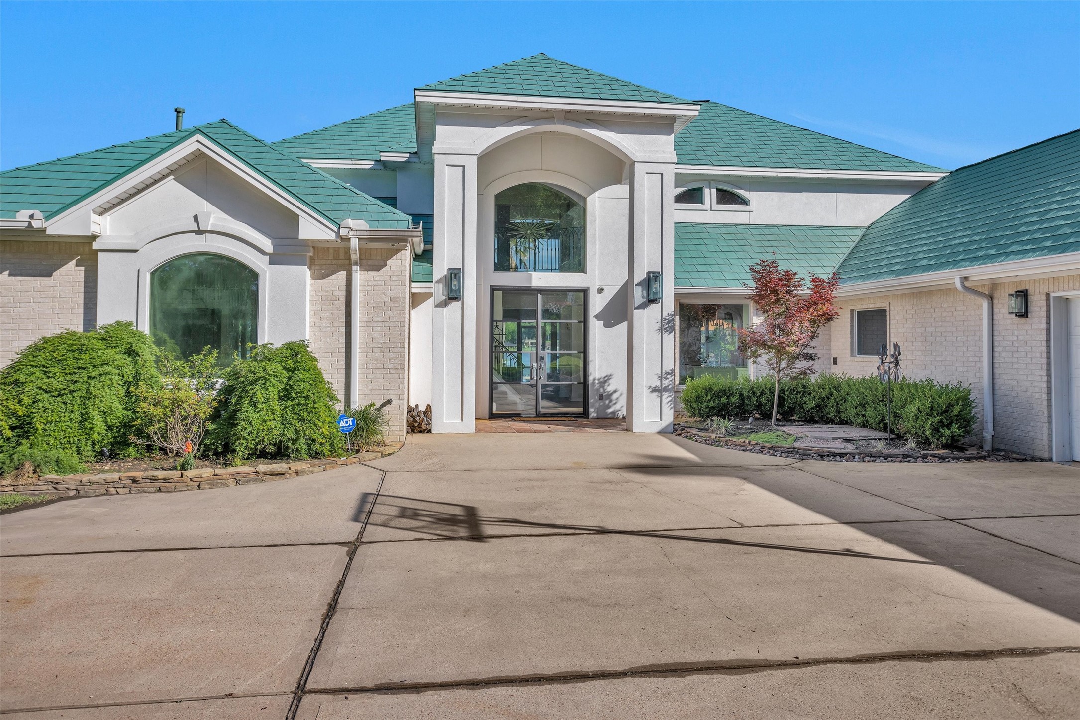 16059 Walden Road Conroe, TX 77356 - Photo 7 of 50 a front view of a house with a yard and a garage