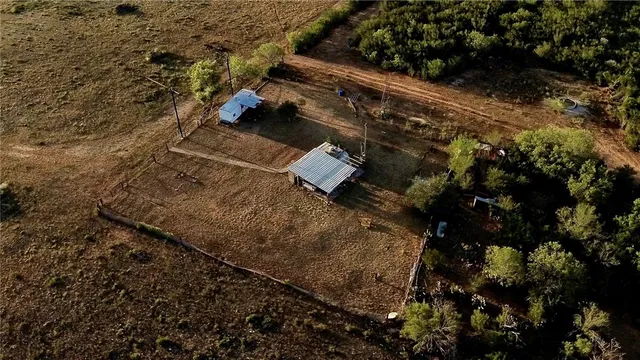 an aerial view of residential house with outdoor space
