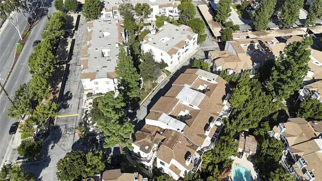 an aerial view of a house with a yard and garden