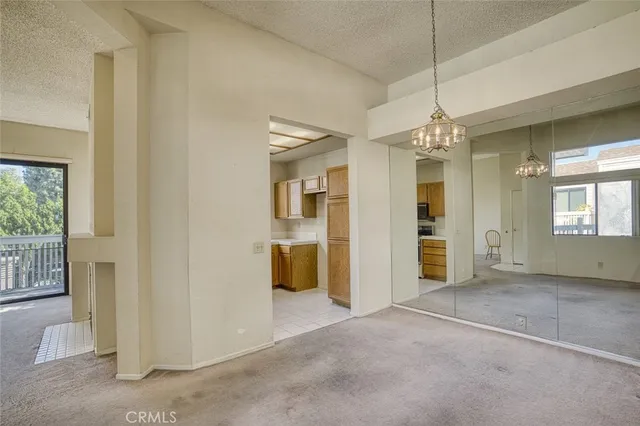 a bathroom with a granite countertop sink a large mirror and a bathtub