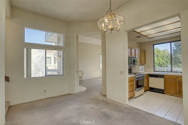 a kitchen with a stove a sink and a microwave