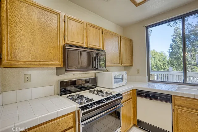 a kitchen with a refrigerator and a sink