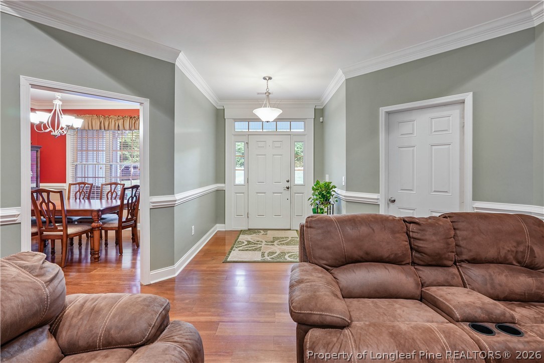 280 Hemp St Extension Robbins, NC 27325 - Photo 6 of 29 a living room with furniture a dining table and a large window