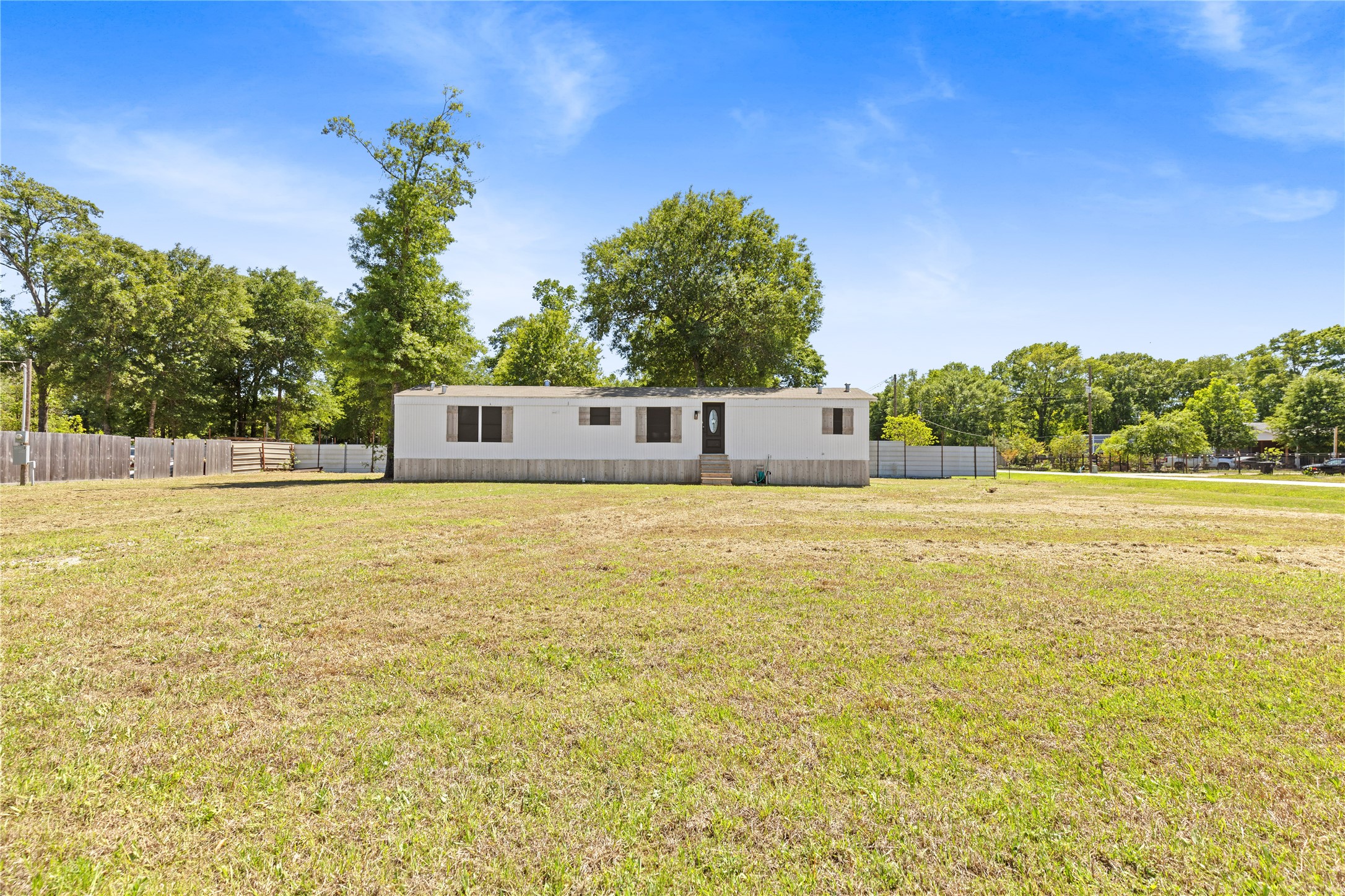 2134 County Road 5017 Cleveland, TX 77327 - Photo 1 of 25 a view of a pool with an outdoor space
