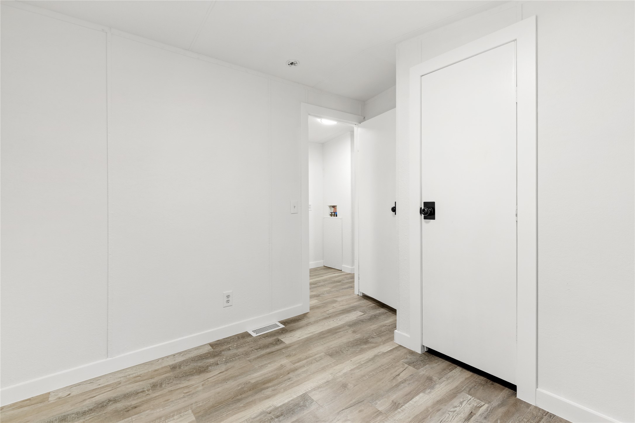 2134 County Road 5017 Cleveland, TX 77327 - Photo 12 of 25 a view of a room with wooden floor
