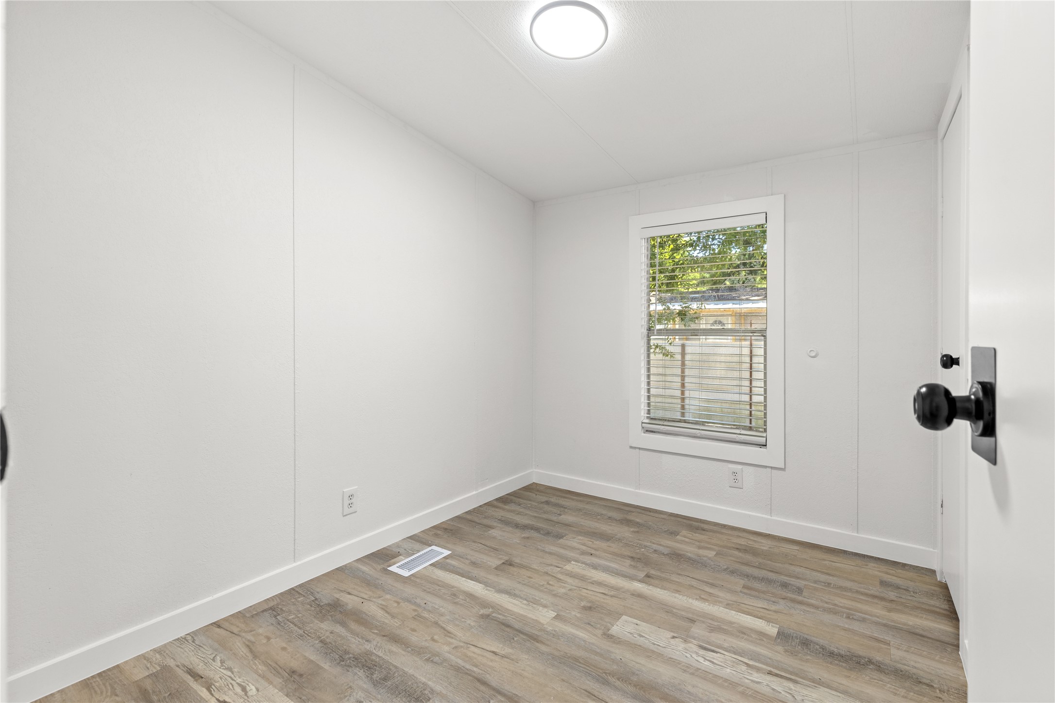 2134 County Road 5017 Cleveland, TX 77327 - Photo 14 of 25 an empty room with a window