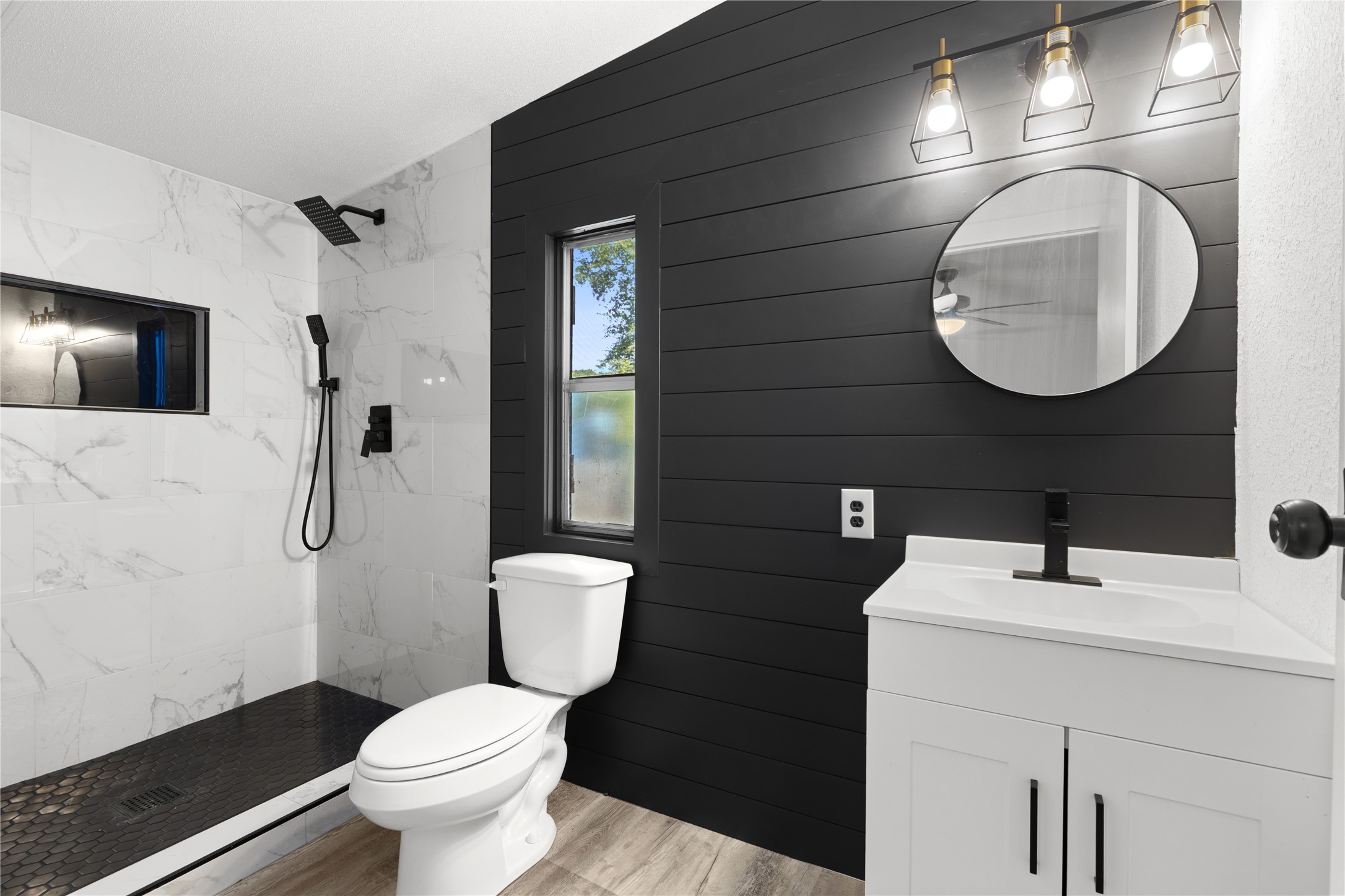 2134 County Road 5017 Cleveland, TX 77327 - Photo 18 of 25 a bathroom with a toilet sink and mirror