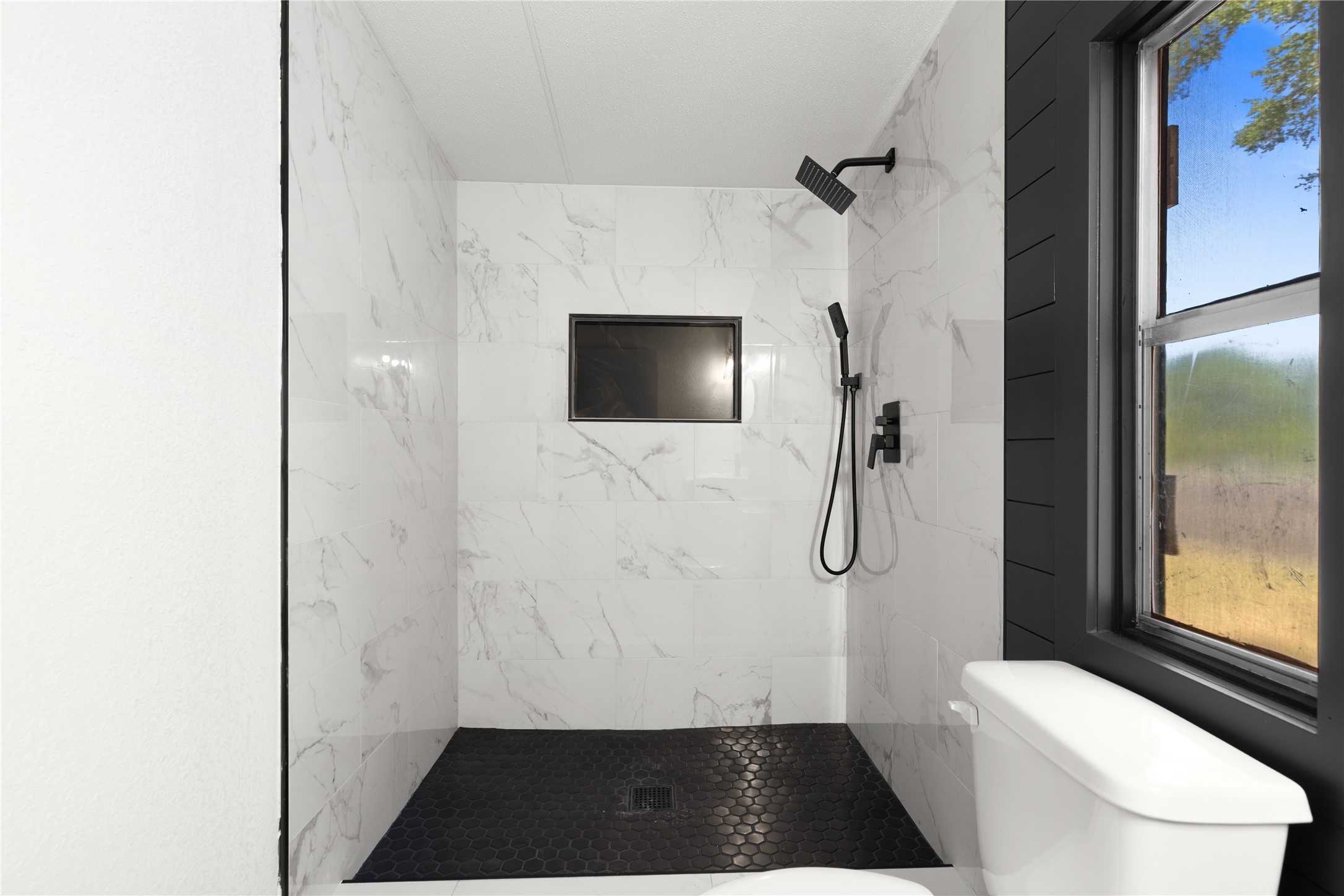2134 County Road 5017 Cleveland, TX 77327 - Photo 19 of 25 a bathroom with a toilet and a shower
