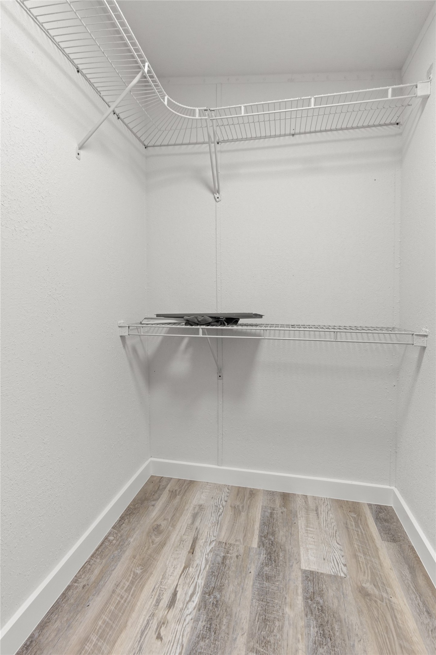 2134 County Road 5017 Cleveland, TX 77327 - Photo 20 of 25 a view of a room with racks on the wall
