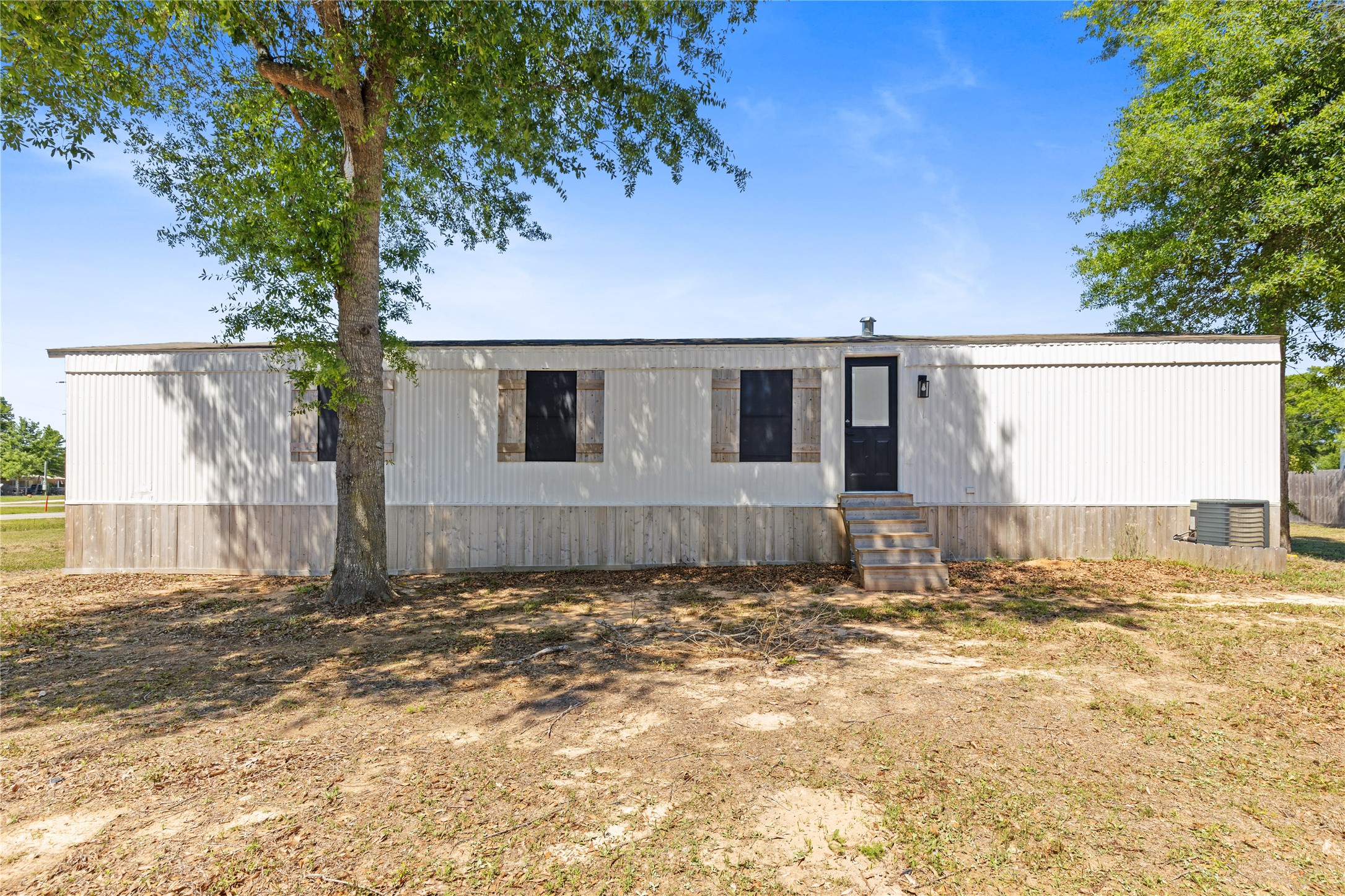 2134 County Road 5017 Cleveland, TX 77327 - Photo 21 of 25 a view of a backyard of a house