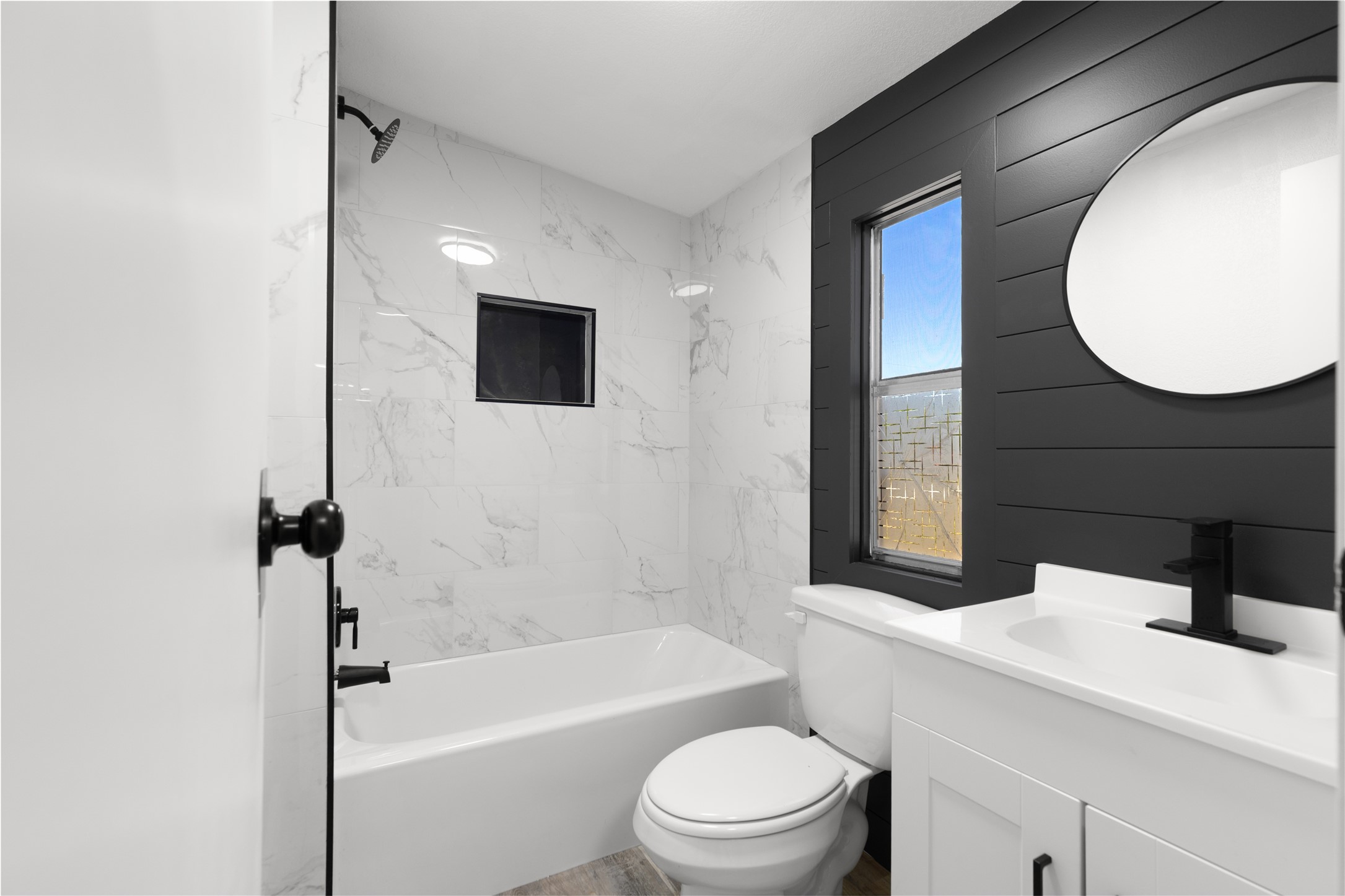 2134 County Road 5017 Cleveland, TX 77327 - Photo 9 of 25 a bathroom with a toilet a sink and bathtub