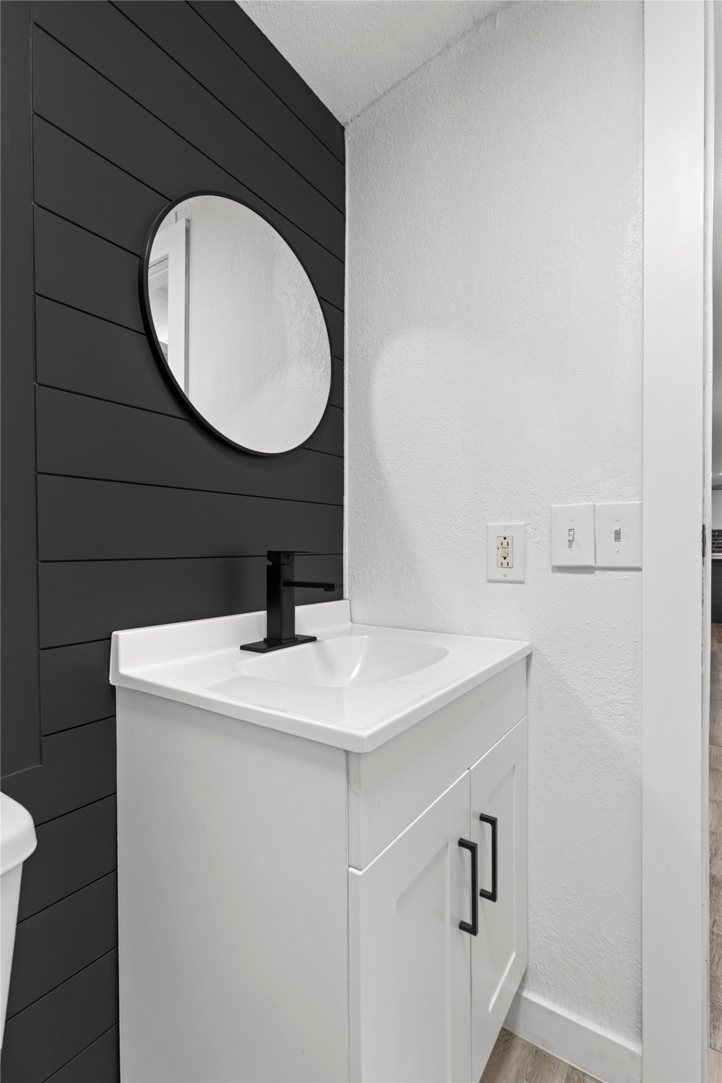 2134 County Road 5017 Cleveland, TX 77327 - Photo 10 of 25 a bathroom with a sink and a mirror